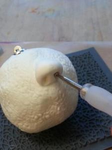 Poke nostrils with an embossing tool